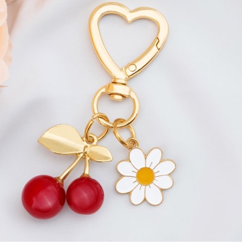 Red Cherry with Daisy bag accessories clip featuring gold hardware